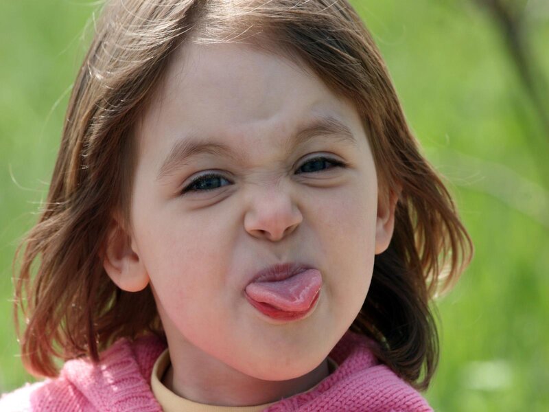 Child Sticking Out Tongue — Pink