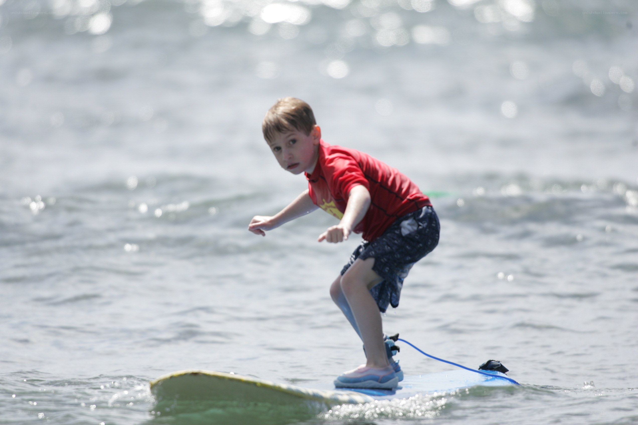 child surfing on a wave