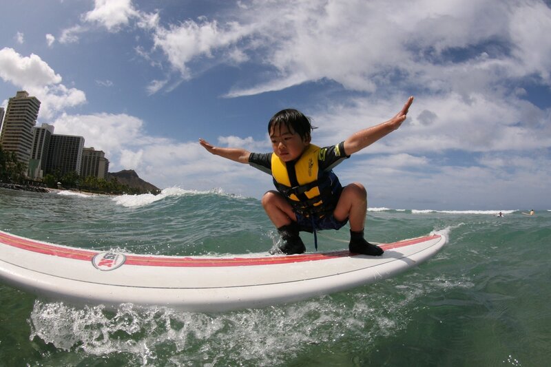 child surfing on a wave