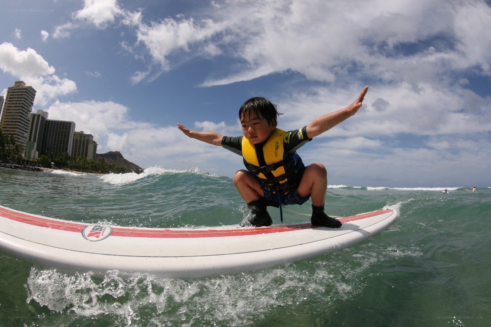 child surfing on a wave
