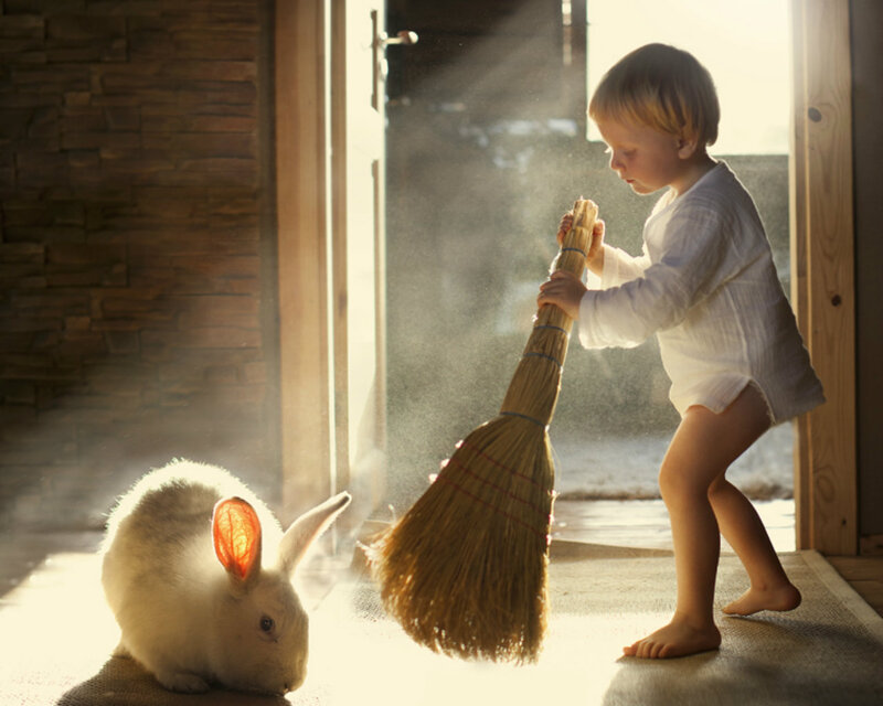 Child Sweeping with Rabbit