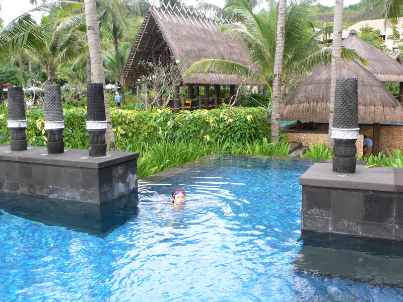 Child Swimming in Pool
