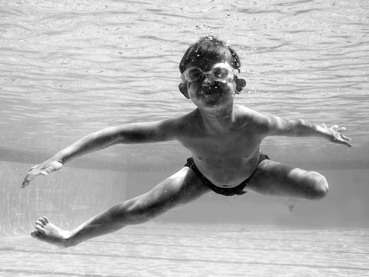 child swimming underwater
