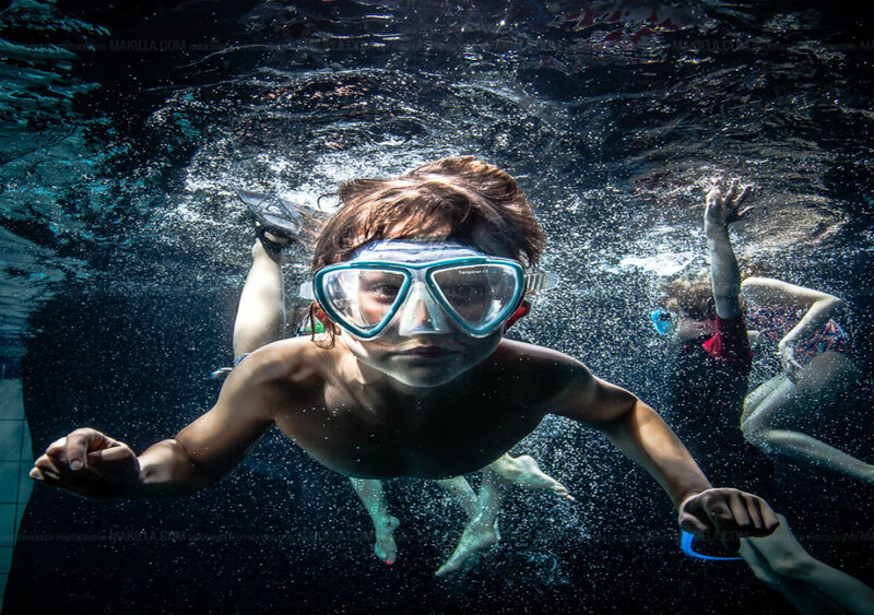 Child Swimming Underwater — Blue