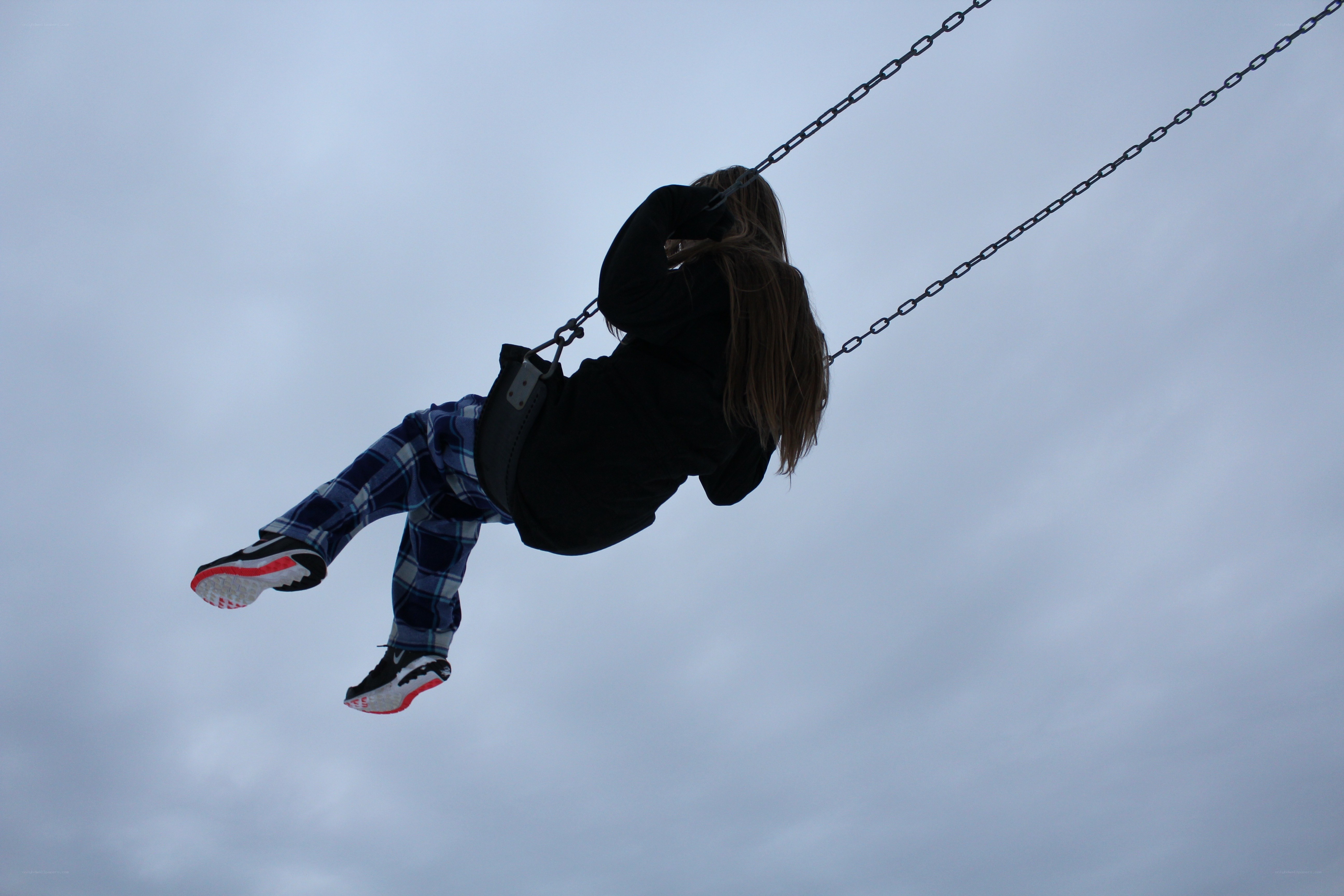 child swinging on a swing