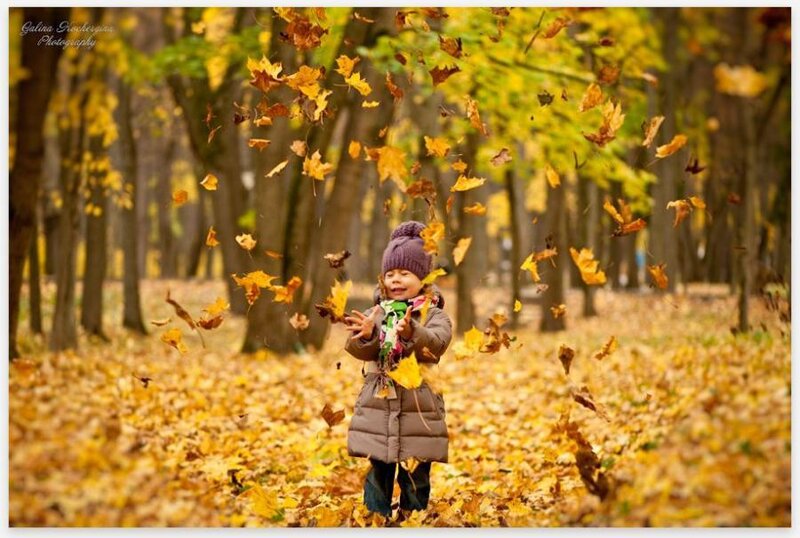 Child Throwing Leaves