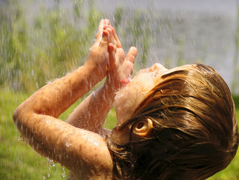 Child under Water Spray