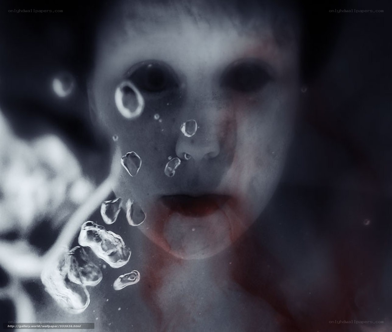 child underwater with bubbles