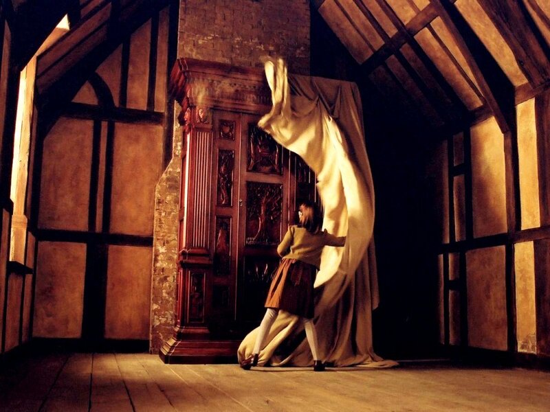 Child unveiling a wardrobe