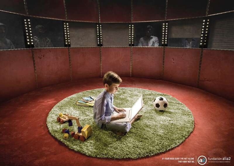 child using laptop in circus ring