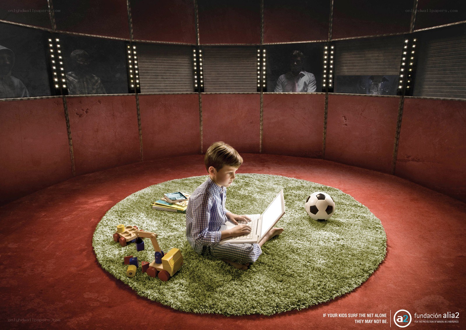 child using laptop in circus ring