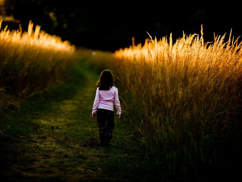 Child Walking in Field