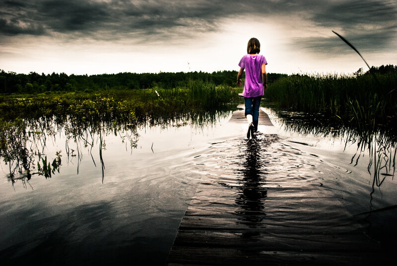 Child Walking on Boardwalk