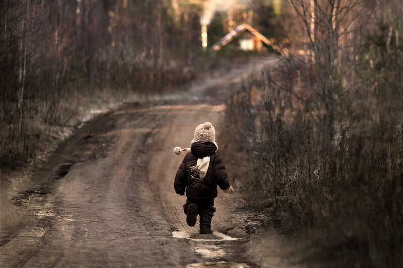 Child Walking on Dirt Path