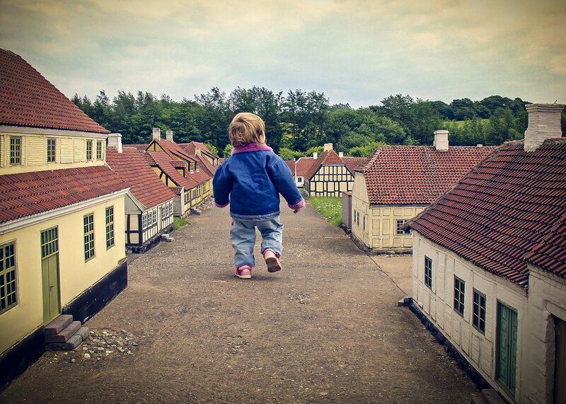 Child Walking on Miniature Street