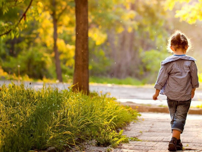 Child Walking on Path — Green, Serene