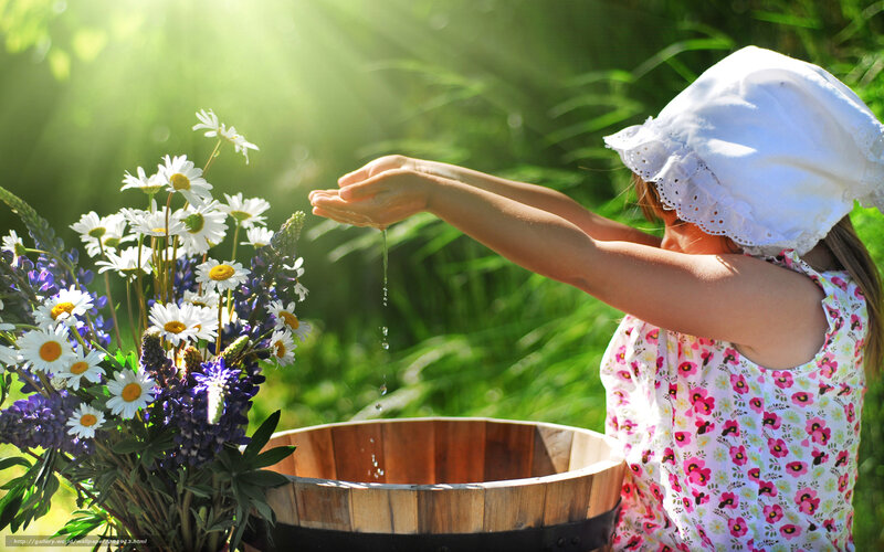 child washing hands with flowers
