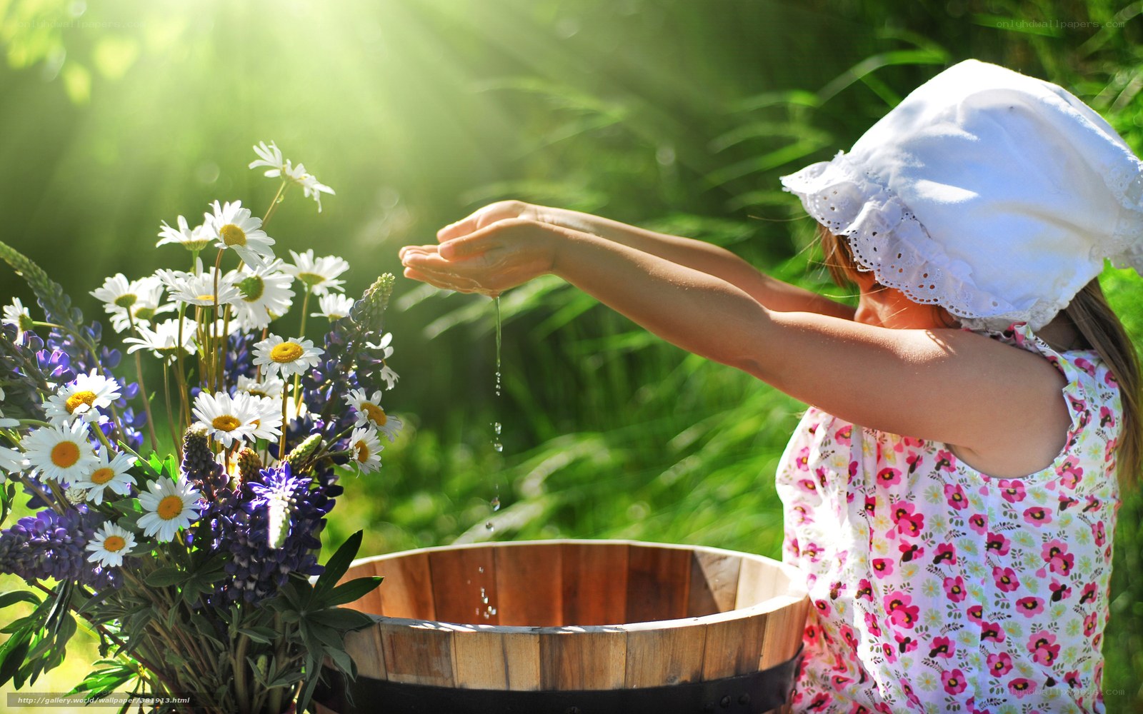 child washing hands with flowers