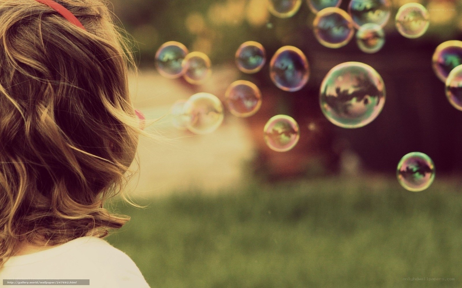 child watching bubbles