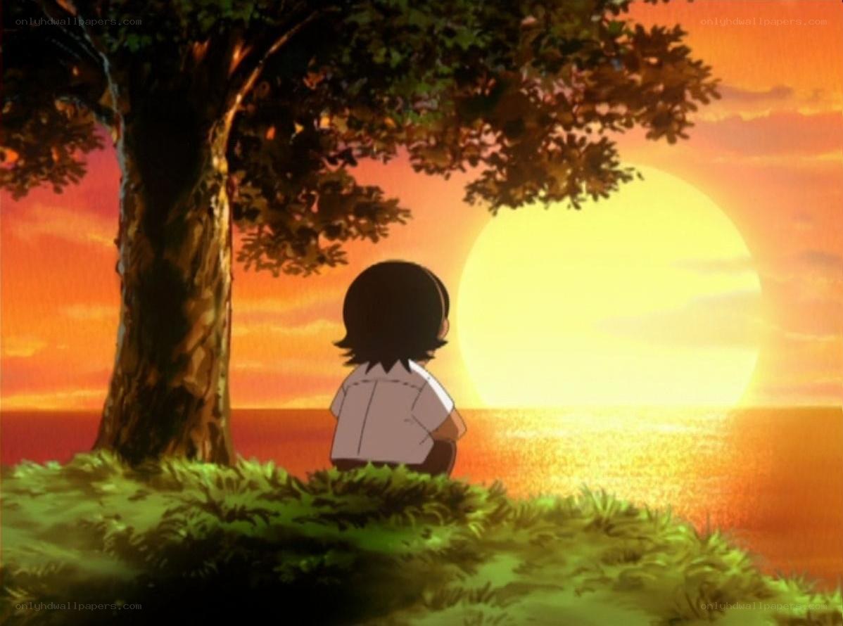 child watching sunset by the sea