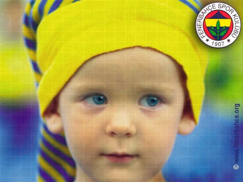 child wearing fenerbahce hat