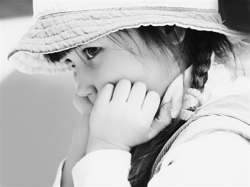 Child Wearing Hat — Black