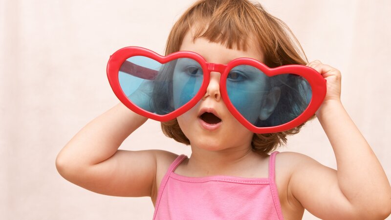 Child Wearing Heart Glasses