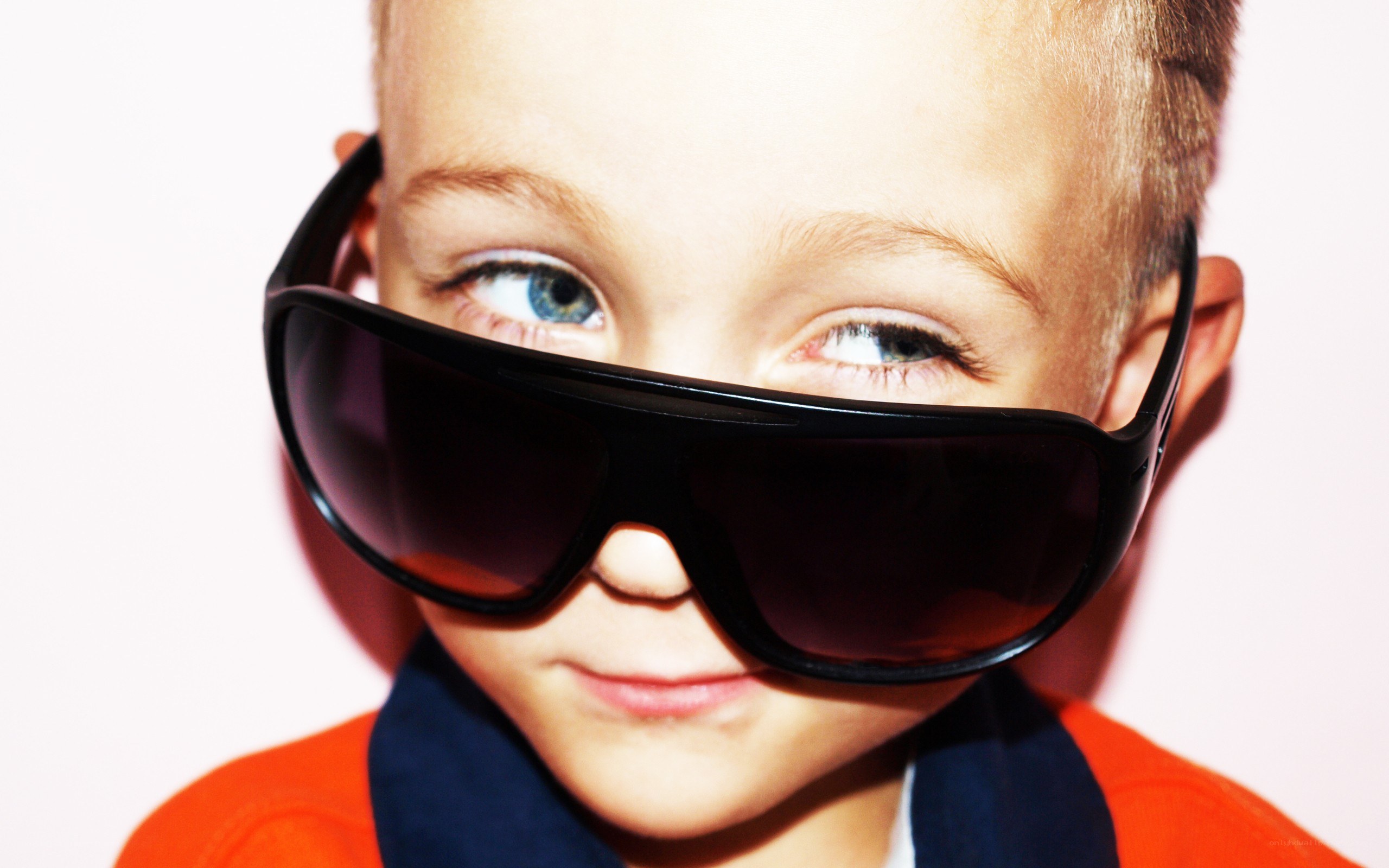 child wearing oversized sunglasses