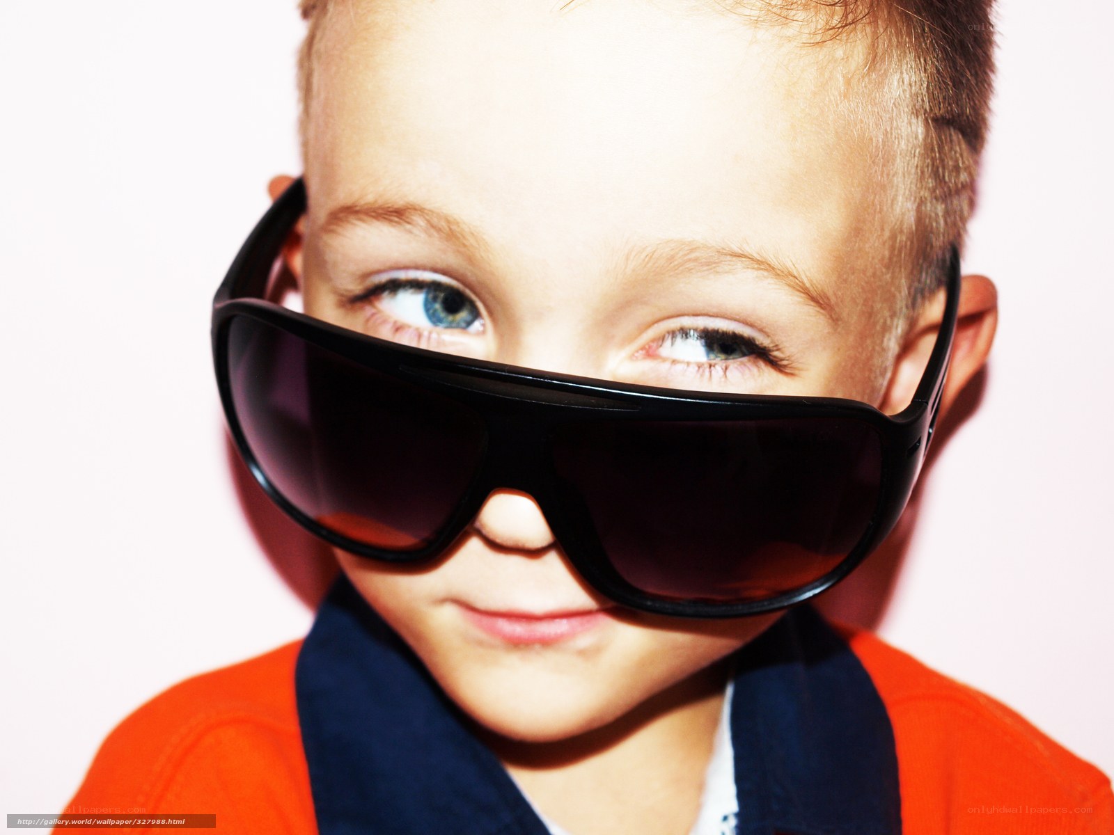 child wearing oversized sunglasses