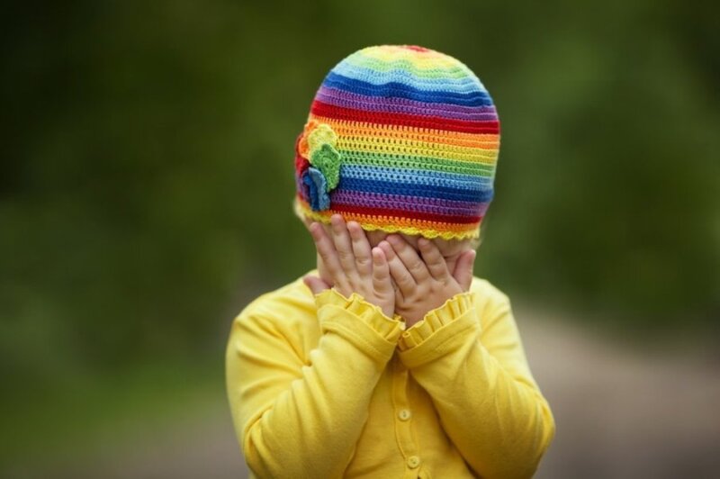 Child Wearing Rainbow Hat