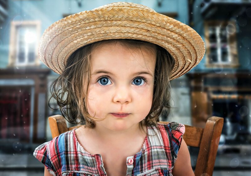 Child Wearing Straw Hat — Blue