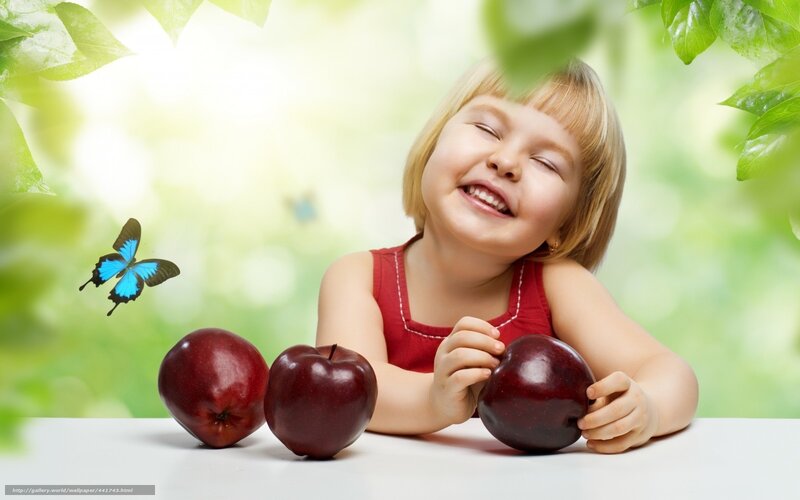 child with apples and butterfly