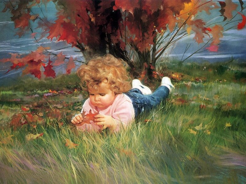 Child with autumn leaf