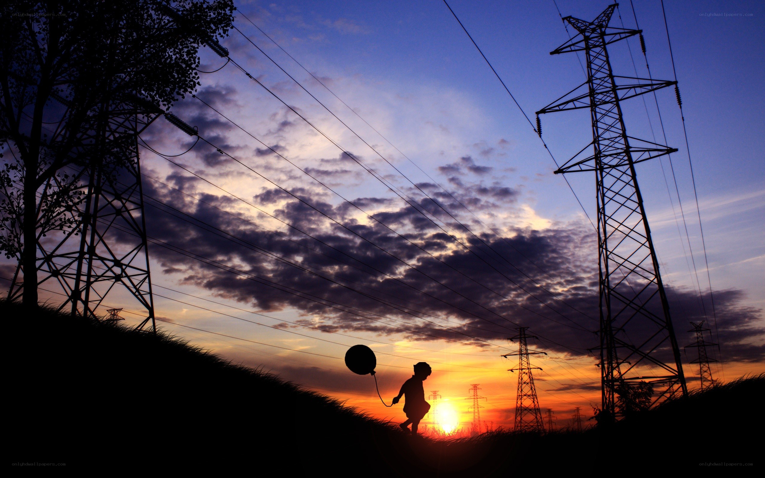 Child with balloon at sunset