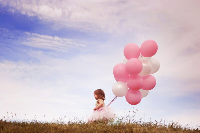 Child with Balloons — Pink