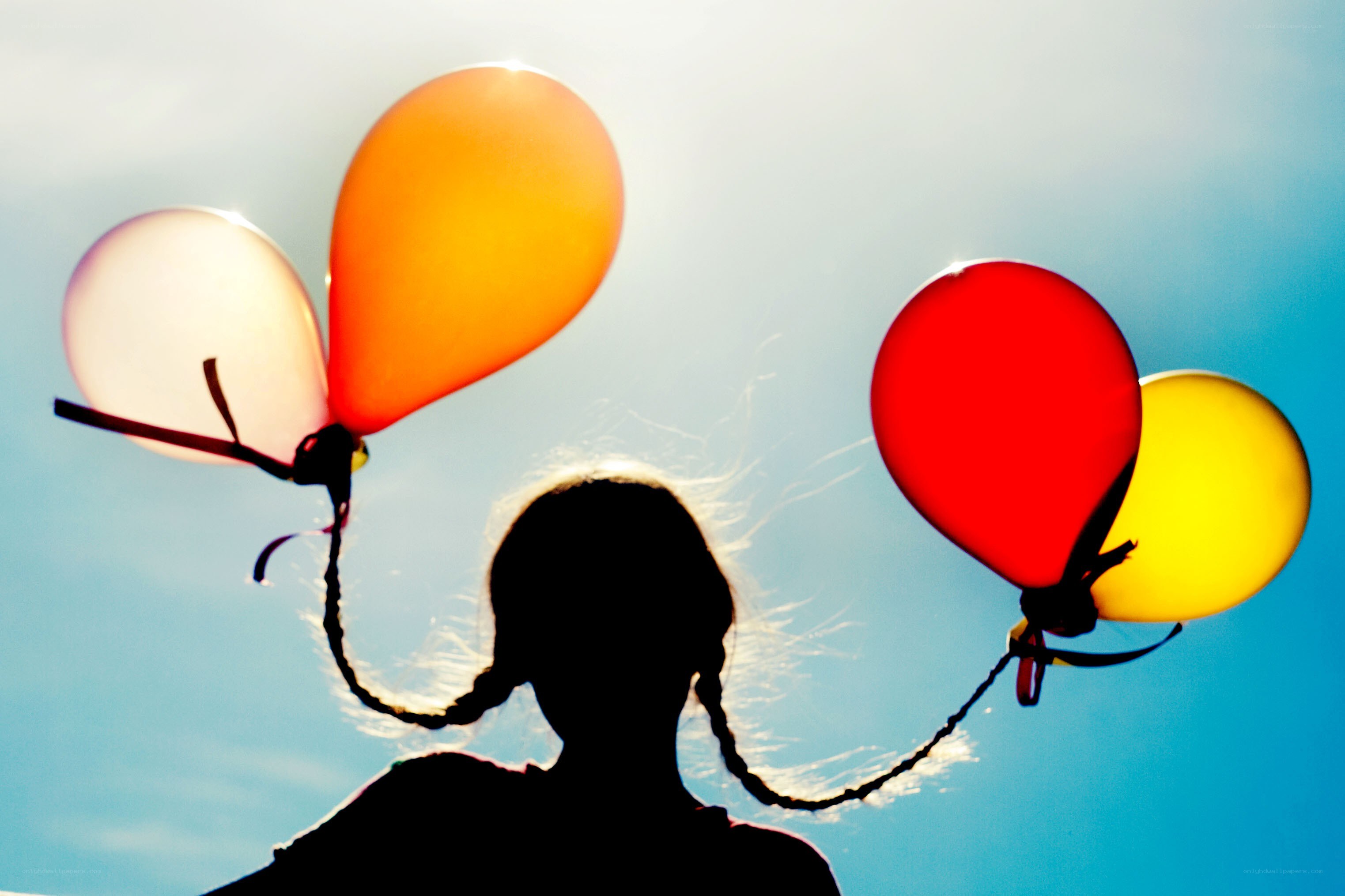 child with balloons silhouette