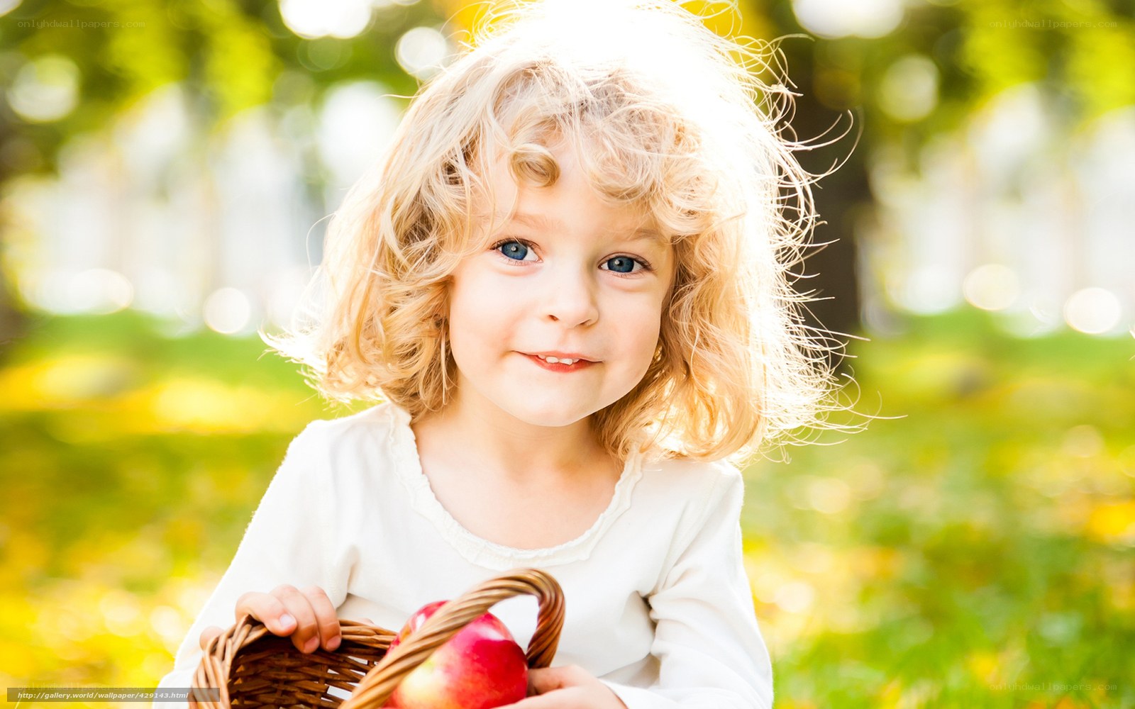 child with basket of apples