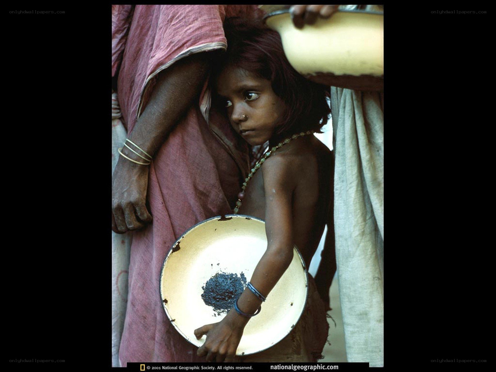 Child with begging bowl