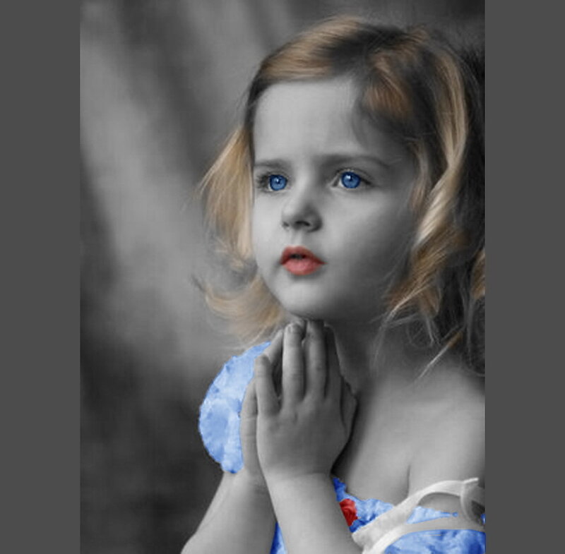 child with blue eyes and dress