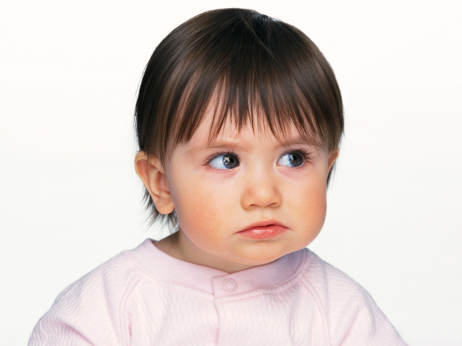 child with blue eyes looking up
