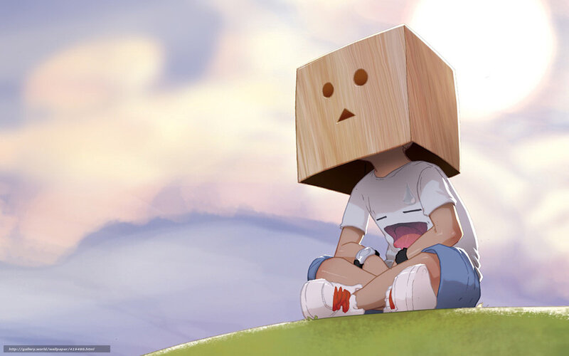 child with box head on hill