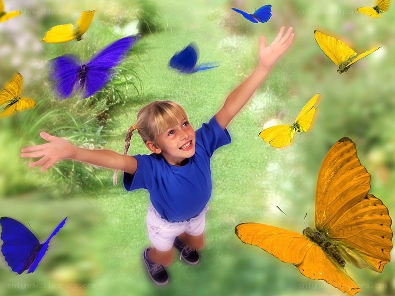 child with butterflies in garden