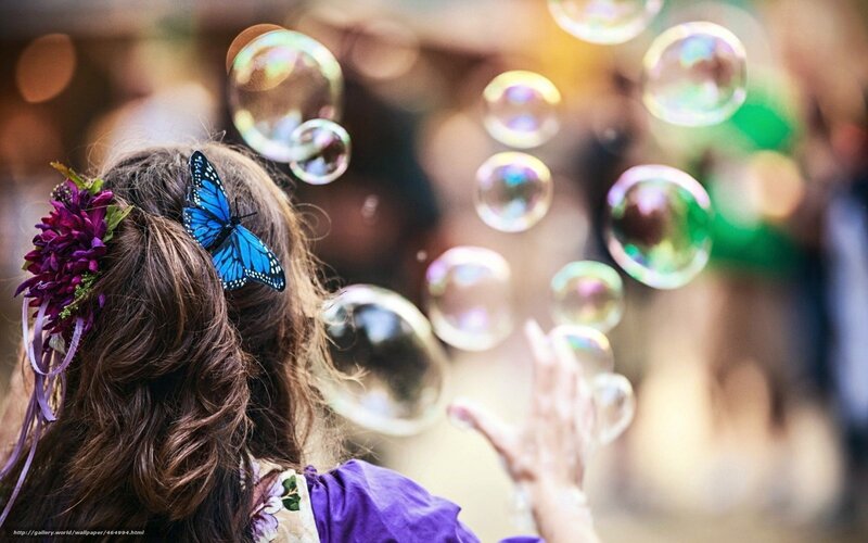 Child with butterfly and bubbles