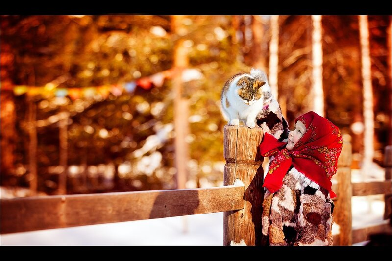 Child with Cat on Fence
