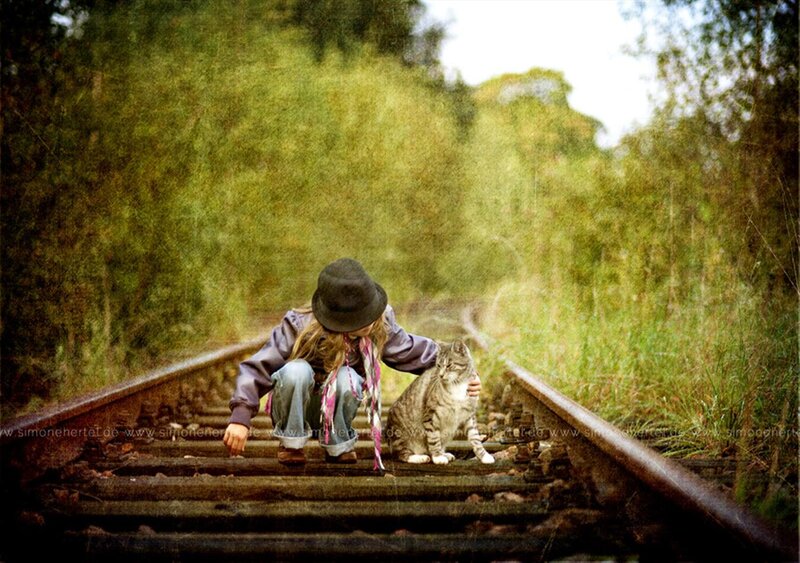 Child with Cat on Tracks