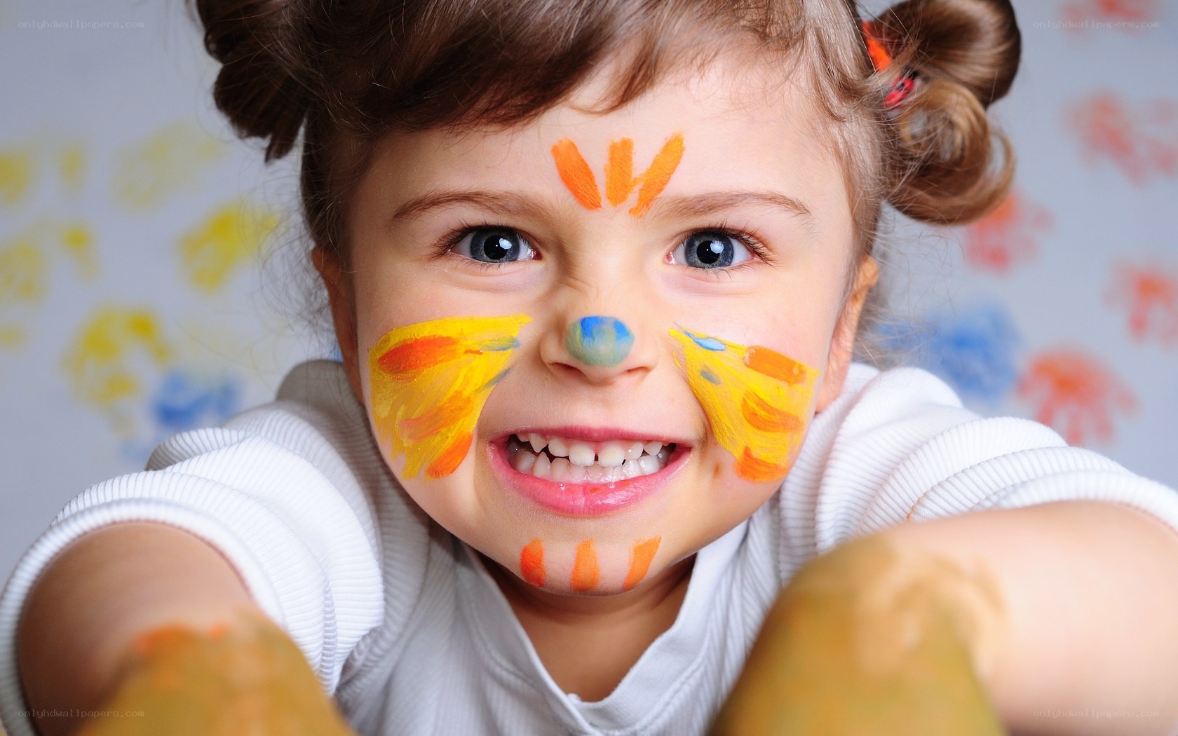 child with colorful face paint