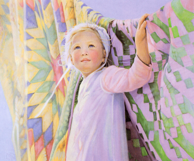 child with colorful quilt