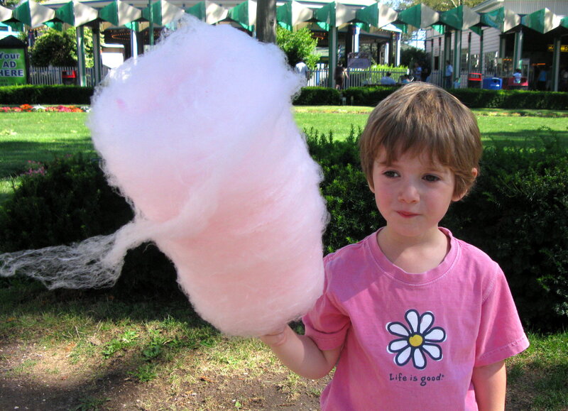 child with cotton candy