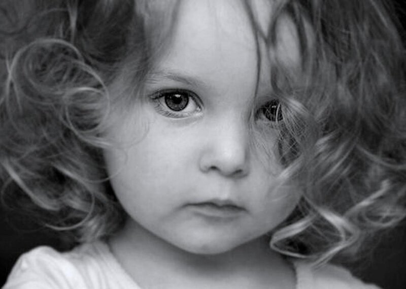 Child with Curly Hair — Black, Serious
