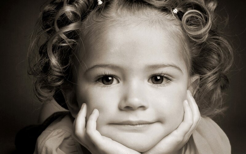 child with curly hair portrait